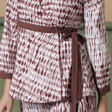 Front Detail of a Model wearing Sangria Wine Shibori Wrap Top