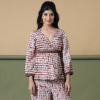 Front View of a Model wearing Sangria Wine Shibori Wrap Top