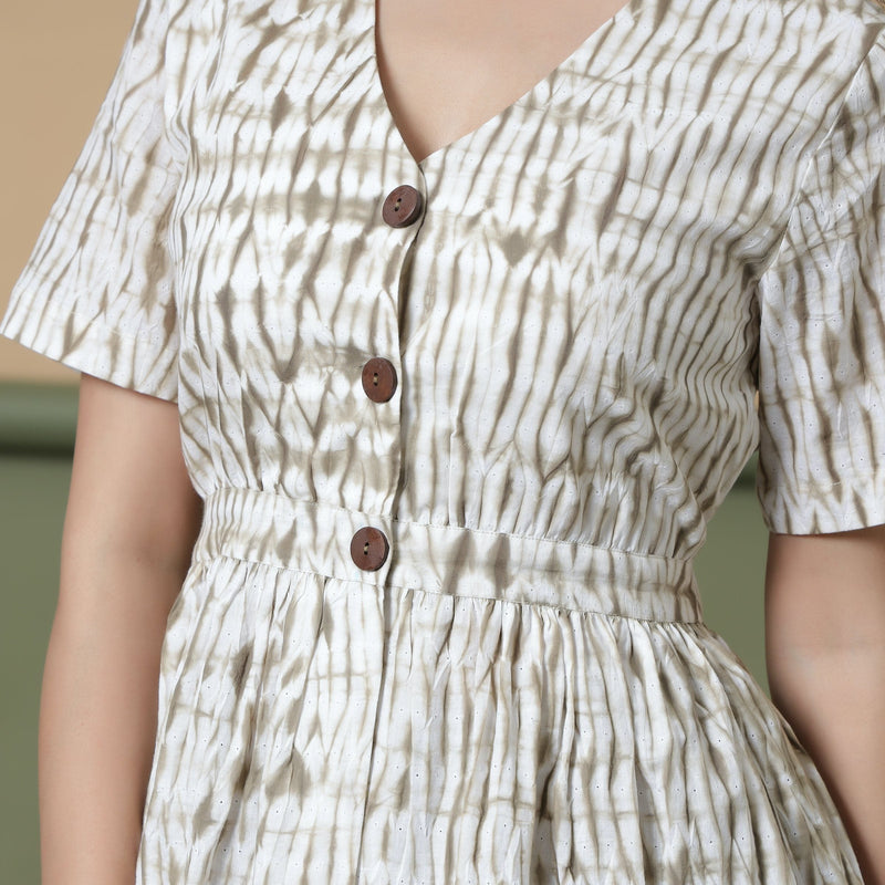 Front Detail of a Model wearing Shibori Button-Down Peplum Top