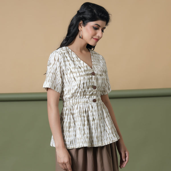 Right View of a Model wearing Shibori Button-Down Peplum Top