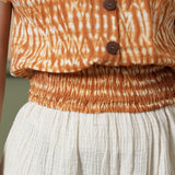 Front Detail of a Model wearing Shibori Button Down Top and Ecru Pant Set
