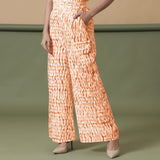 Front View of a Model wearing Sunset Orange Shibori Wide Legged Pant