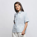 Left View of a Model wearing Sky Blue Yarn Dyed Button-Down Shirt