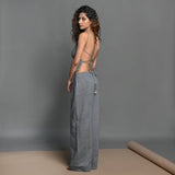 Left View of a Model wearing Slate Grey Backless Cami Top and Pant Set