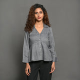 Front View of a Model wearing Slate Grey Handspun Cotton Peplum Top