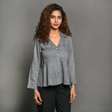 Front View of a Model wearing Slate Grey Handspun Cotton Peplum Top