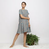 Right View of a Model wearing Soft Handspun Cotton Muslin Flared Dress