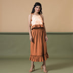 Front View of a Model wearing Orange Camisole Top and Ruffled Skirt Set
