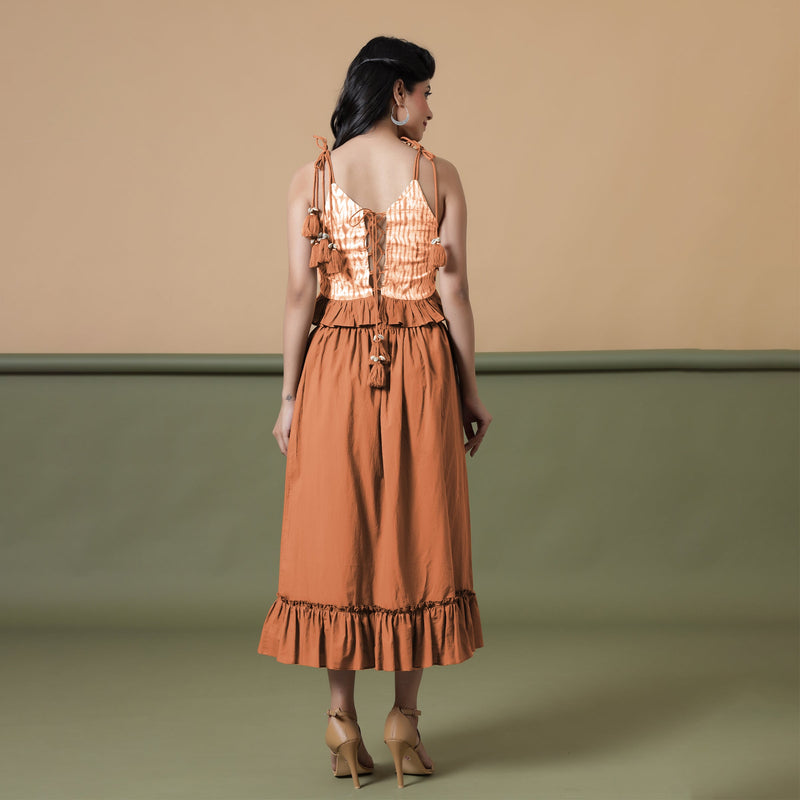Back View of a Model wearing Orange A-Line Ruffled Cotton Skirt