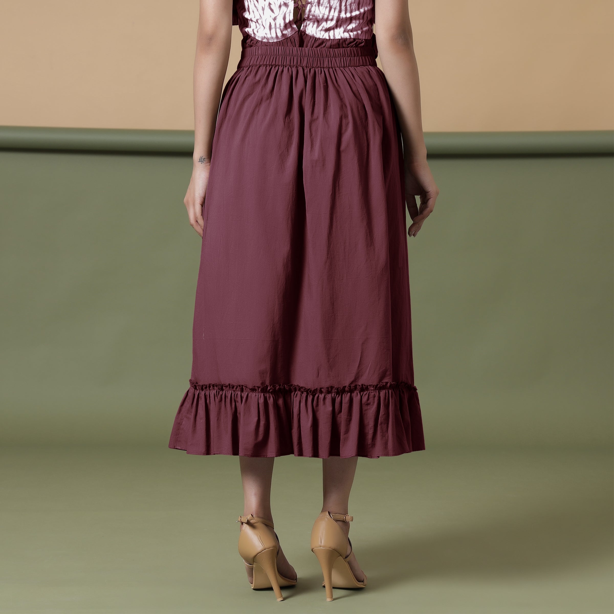 Back View of a Model wearing Maroon A-Line Ruffled Cotton Skirt
