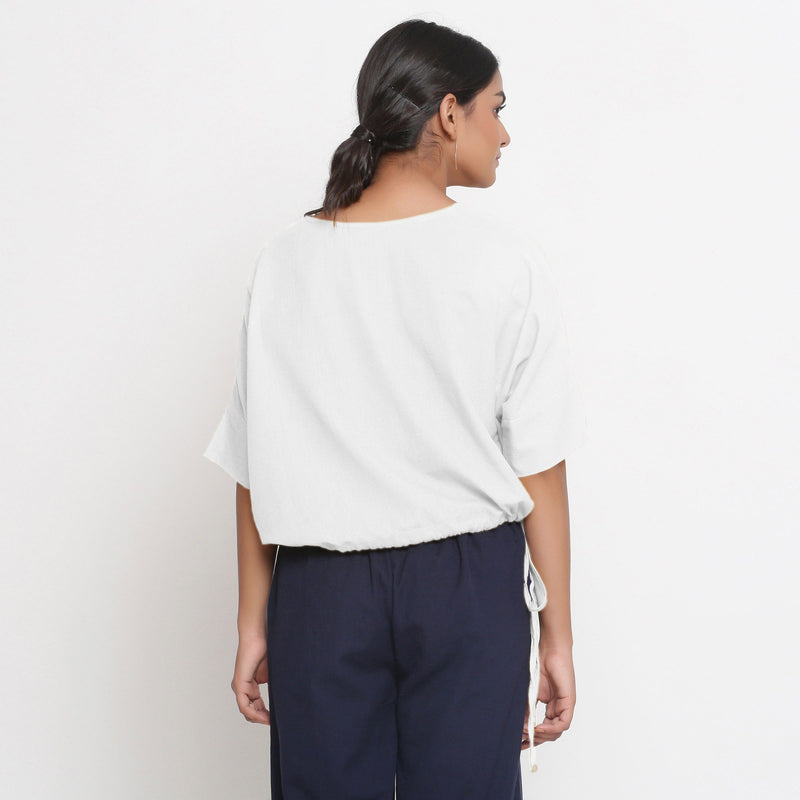 Back View of a Model wearing Solid White Cotton Flax Blouson Top