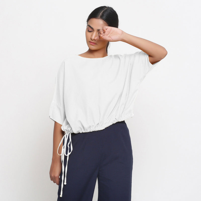 Front View of a Model wearing White Blouson Top and Navy Blue Culottes Set
