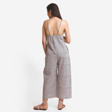 Back View of a Model wearing Striped Camisole Wide Legged Jumpsuit