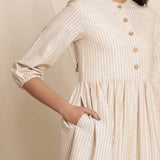 Front Detail of a Model wearing Warm Flannel Dusk Beige Gathered Dress