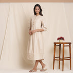 Left View of a Model wearing Warm Flannel Dusk Beige Gathered Dress