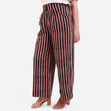 Left View of a Model wearing Striped High-Rise Baggy Cotton Pant