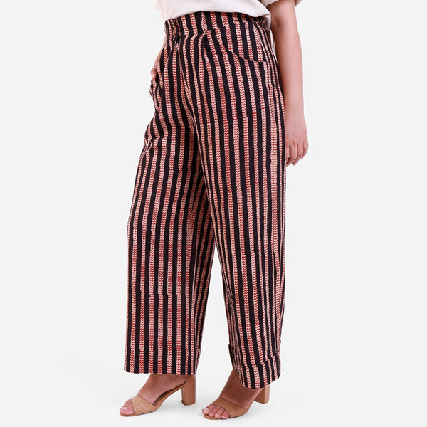 Left View of a Model wearing Striped High-Rise Baggy Cotton Pant