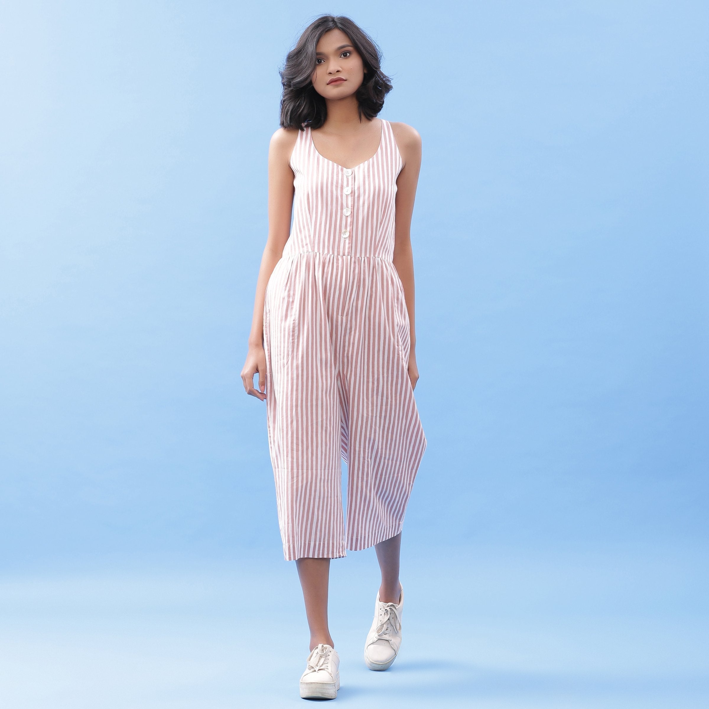 Front View of a Model wearing Striped Pink Cotton Button-Down Jumpsuit
