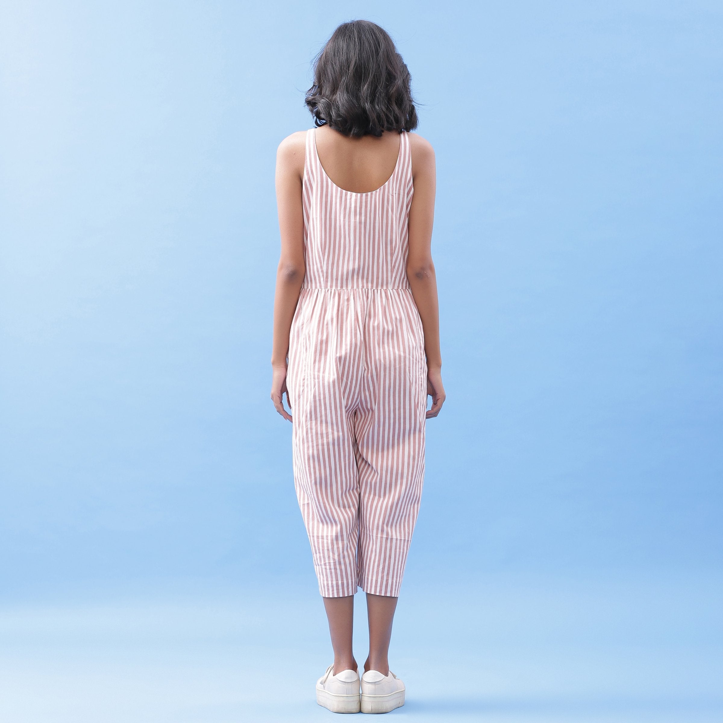 Back View of a Model wearing Striped Pink Cotton Button-Down Jumpsuit