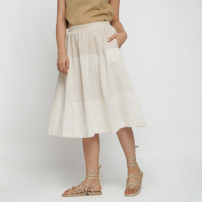 Left View of a Model wearing Striped Pleated High Rise Paneled Skirt