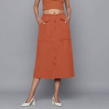 Front View of a Model wearing Sunset Rust Button-Down Midi Skirt