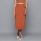 Front View of a Model wearing Sunset Rust Button-Down Midi Skirt