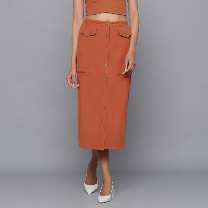 Front View of a Model wearing Sunset Rust Button-Down Midi Skirt