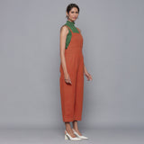 Right View of a Model wearing Sunset Rust Cotton Corduroy Dungaree