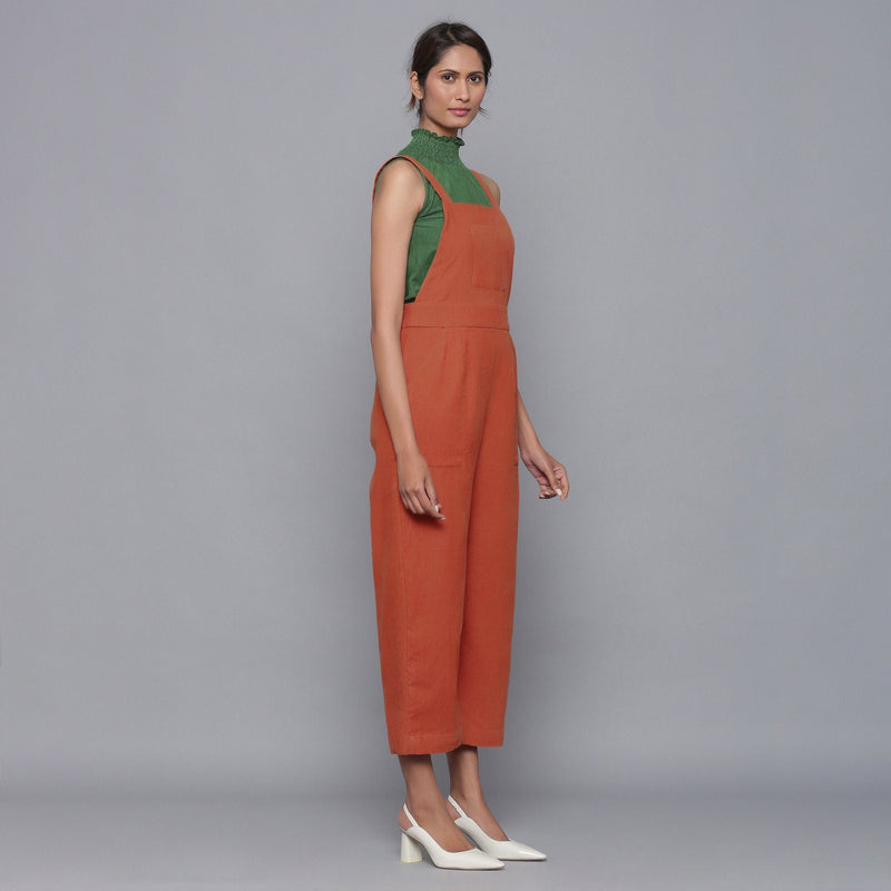 Right View of a Model wearing Sunset Rust Cotton Corduroy Dungaree