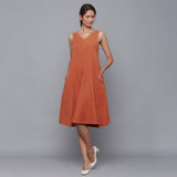 Front View of a Model wearing Sunset Rust Corduroy Flared Dress