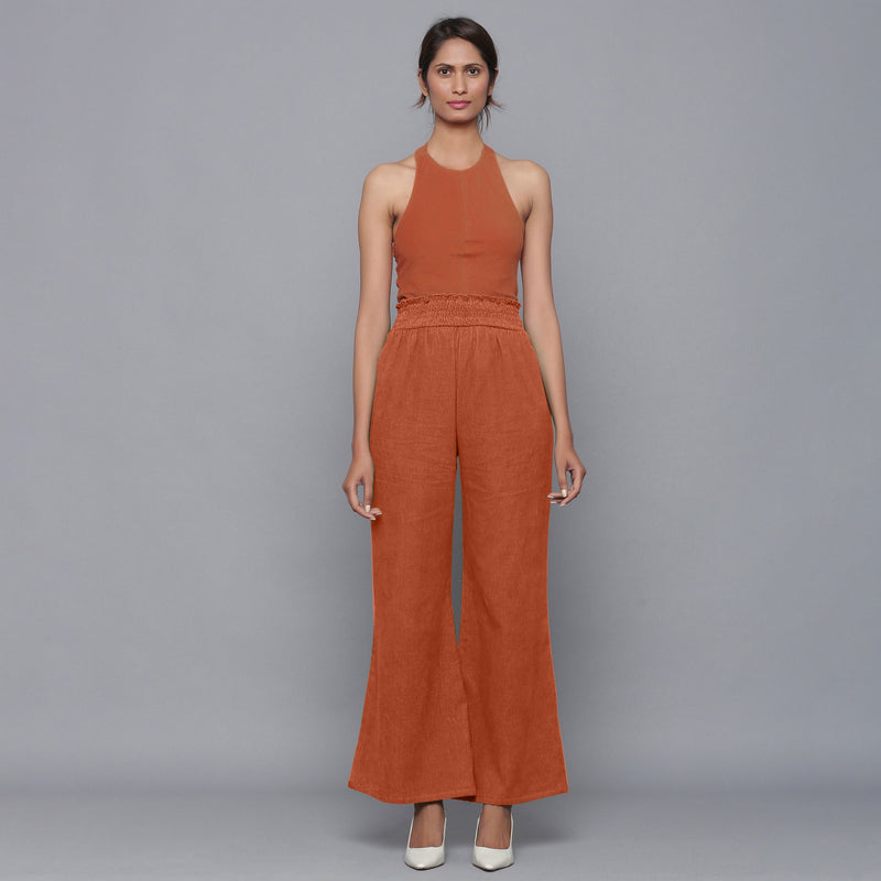 Front View of a Model wearing Sunset Rust Top and Striped Pant Set