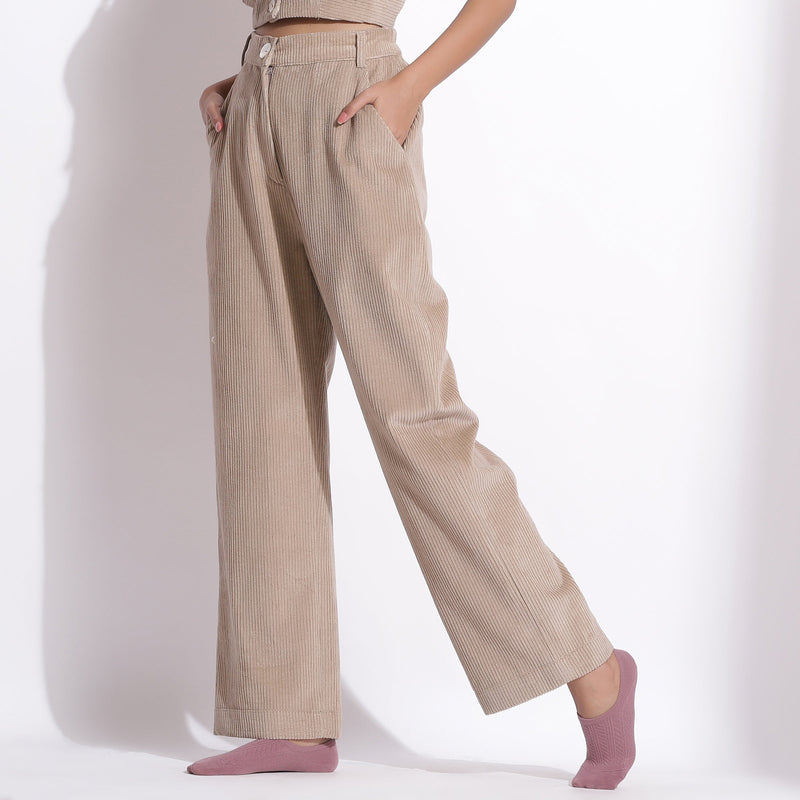 Left View of a Model wearing Taupe Beige Corduroy Wide-Legged Trouser Pant