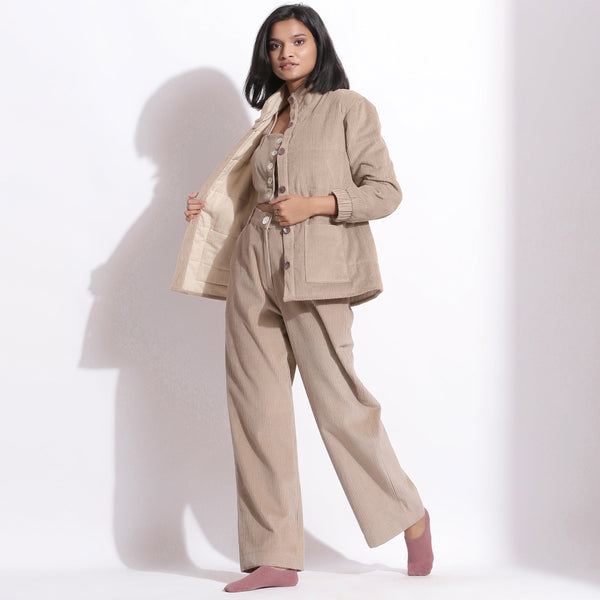 Left View of a Model wearing Taupe Beige Pant and Quilted Jacket Set