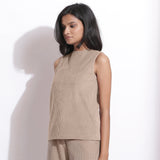 Left View of a Model wearing Taupe Beige Cotton Corduroy Funnel Neck Top