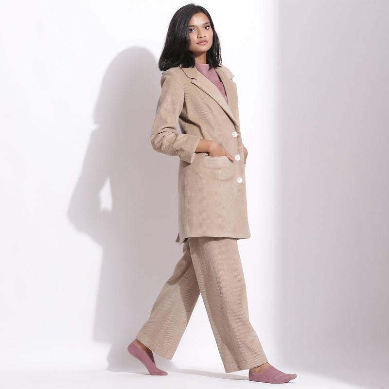 Right View of a Model wearing Taupe Beige Trouser Pant and Long Coat Set