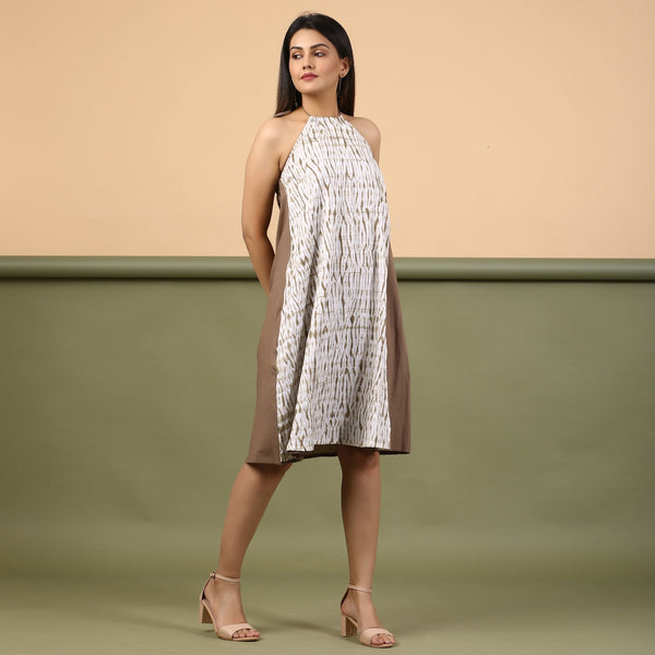 Right View of a Model wearing Taupe Shibori Halter Neck A-Line Dress