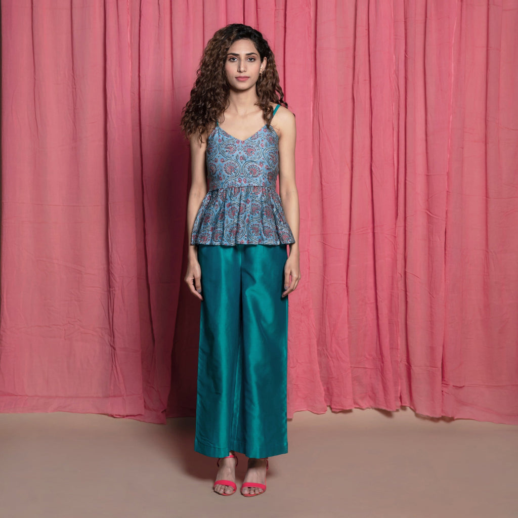 Front View of a Model wearing Teal Block Printed Chanderi Peplum Top