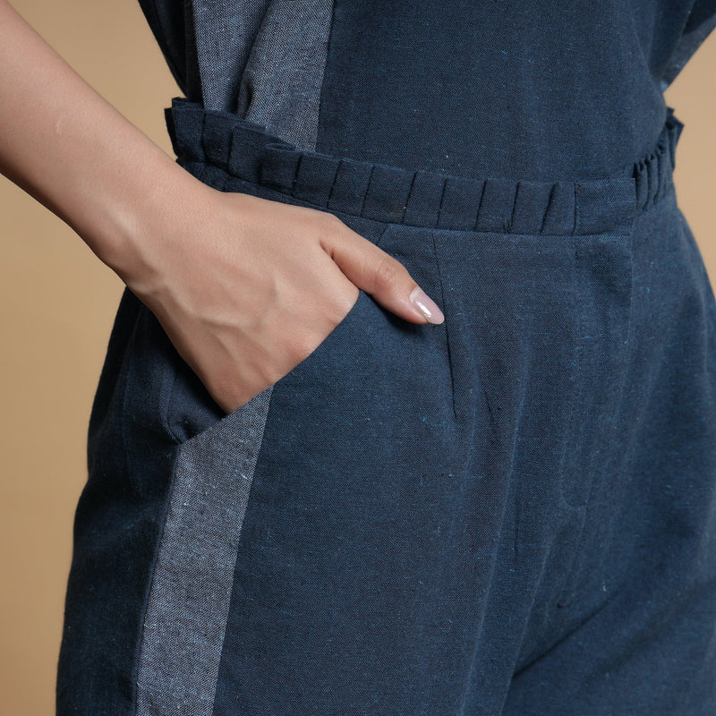 Front Detail of a Model wearing Teal Blue Side-Panelled Paperbag Pant