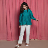 Front View of a Model wearing Teal Chanderi Button Down Tier Top