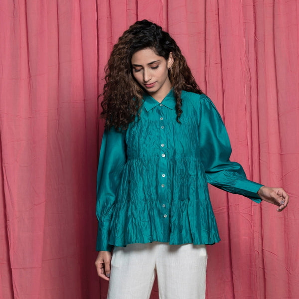 Front View of a Model wearing Teal Chanderi Button Down Tier Top