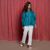 Front View of a Model wearing Teal Chanderi Button Down Tier Top