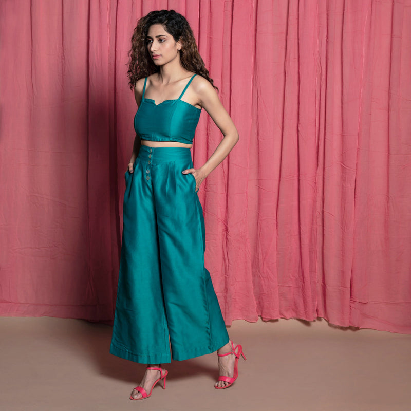 Left View of a Model wearing Teal Chanderi Crop Top and Pant Set