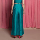 Back View of a Model wearing Teal Chanderi High Rise Wide Legged Pants