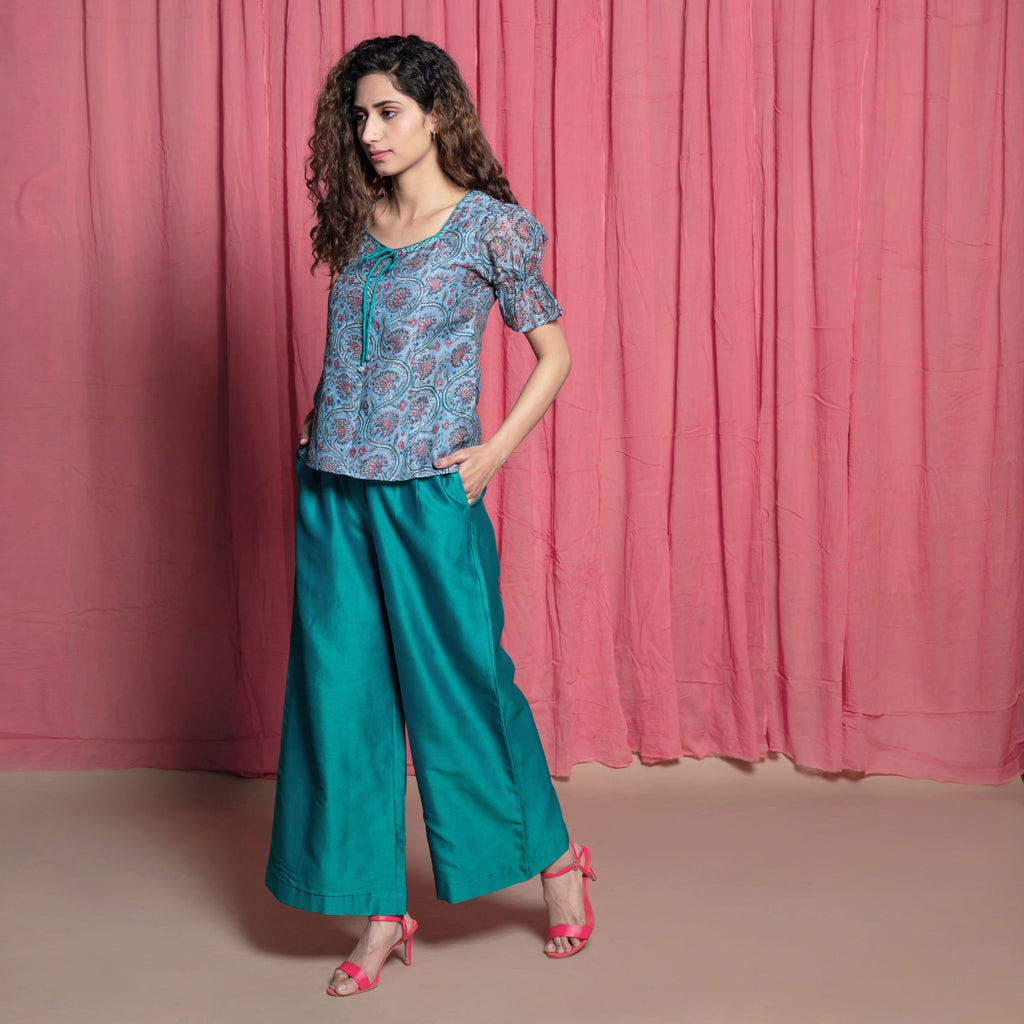 Left View of a Model wearing Teal Hand Block Printed Chanderi Paneled Top