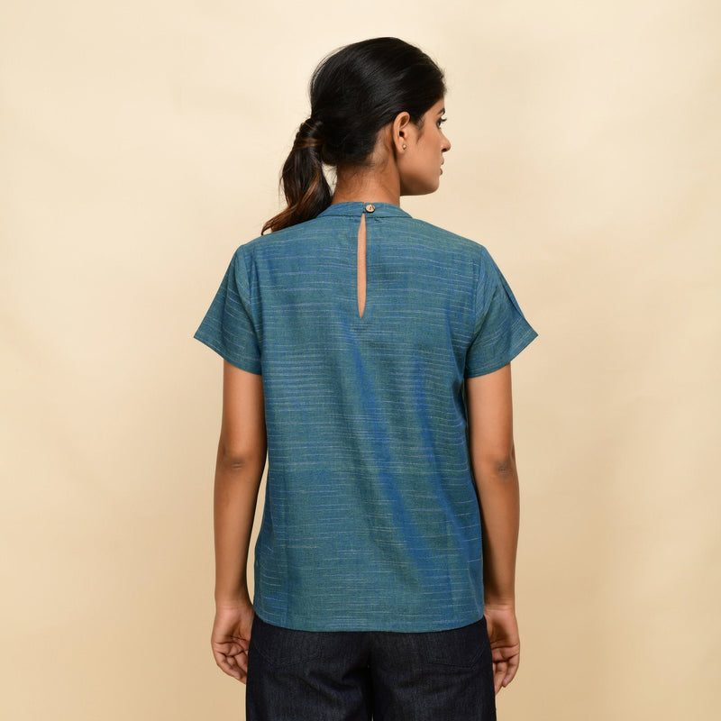 Back View of a Model wearing Teal Handspun Cotton Relaxed Fit Gathered Top