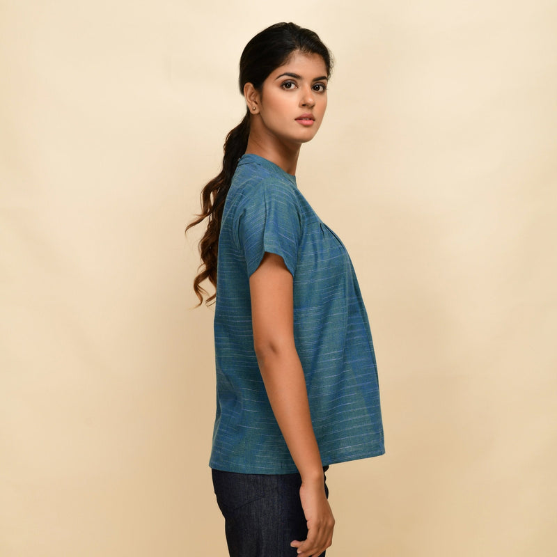Right View of a Model wearing Teal Handspun Cotton Relaxed Fit Gathered Top