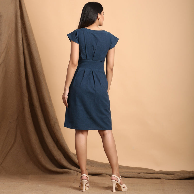 Back View of a Model wearing Teal Pleated Cap Sleeves Dress