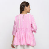 Back View of a Model wearing Pink Tie Dyed Flowy Cotton Gathered Top