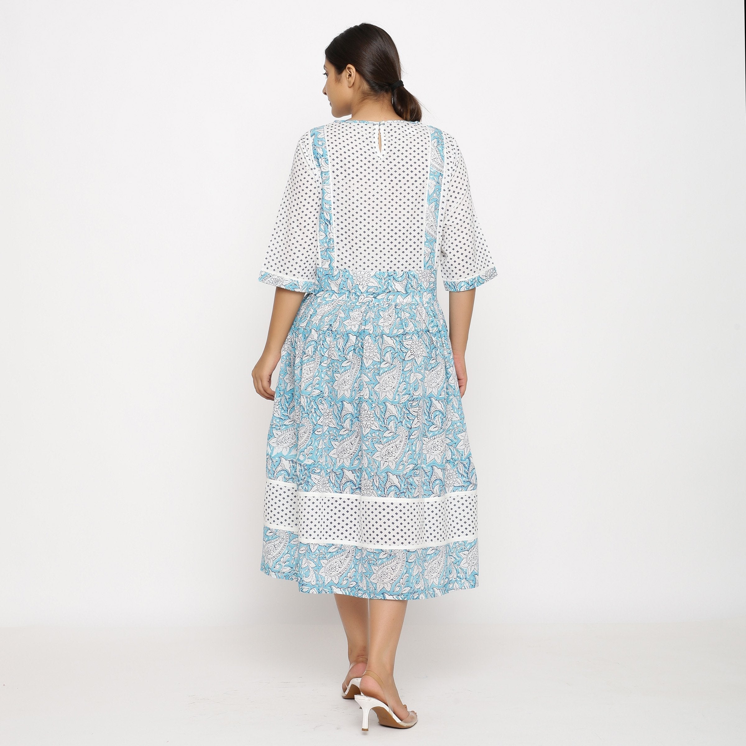Back View of a Model wearing Turquoise Block-Printed Lace Dress