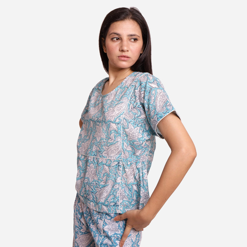 Left View of a Model wearing Turquoise Sanganeri Paisley Print Top